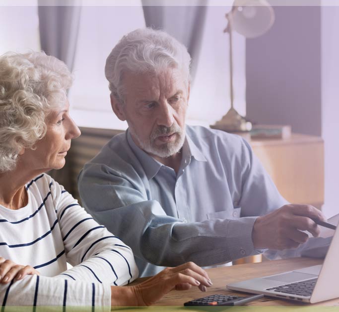 Older adult child with parent online researching resources